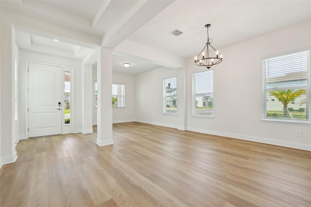 16354 Silver Grove Blvd, Winter Garden, FL 34787 - entryway featuring light wood-style flooring, a chandelier, and baseboards