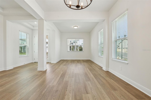 16354 Silver Grove Blvd, Winter Garden, FL 34787 - foyer entrance featuring a chandelier, wood finished floors, and baseboards
