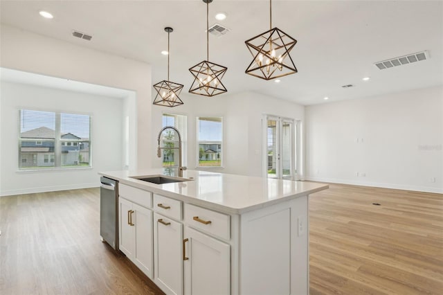 16354 Silver Grove Blvd, Winter Garden, FL 34787 - kitchen featuring a sink, open floor plan, dishwasher, light wood finished floors, and recessed lighting