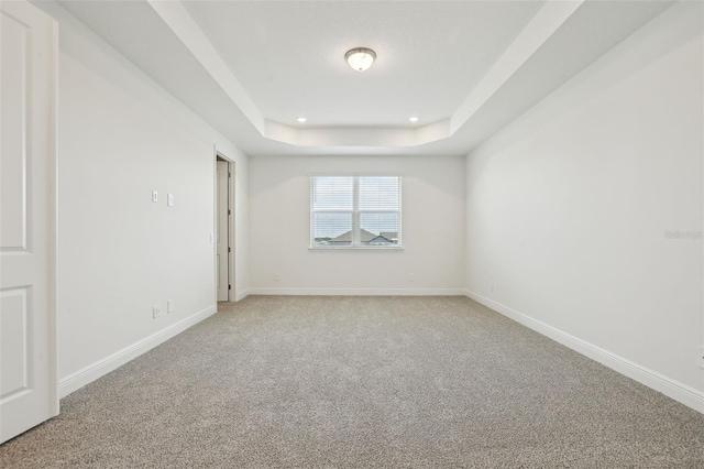 16354 Silver Grove Blvd, Winter Garden, FL 34787 - empty room featuring light carpet, a tray ceiling, baseboards, and recessed lighting
