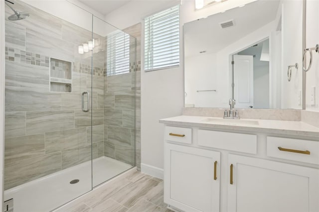 16354 Silver Grove Blvd, Winter Garden, FL 34787 - full bathroom with a stall shower, vanity, and baseboards