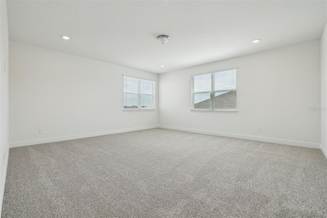 16354 Silver Grove Blvd, Winter Garden, FL 34787 - unfurnished room with baseboards, light carpet, and recessed lighting