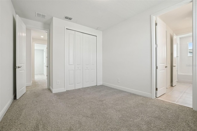16354 Silver Grove Blvd, Winter Garden, FL 34787 - unfurnished bedroom with carpet flooring, a closet, and baseboards