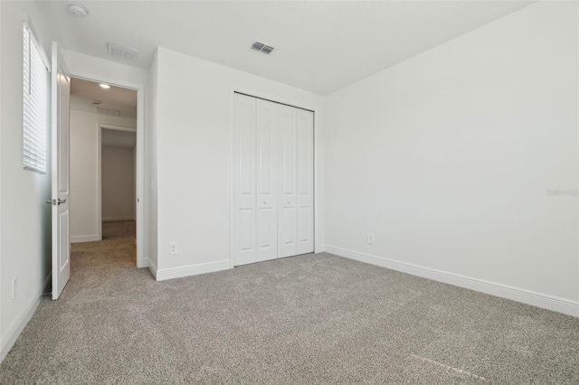16354 Silver Grove Blvd, Winter Garden, FL 34787 - unfurnished bedroom featuring carpet, baseboards, and a closet