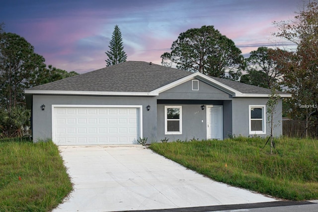 ranch-style house with stucco siding, concrete driveway, and a garage