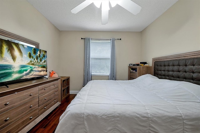 bedroom with baseboards, a textured ceiling, ceiling fan, and dark wood-style flooring