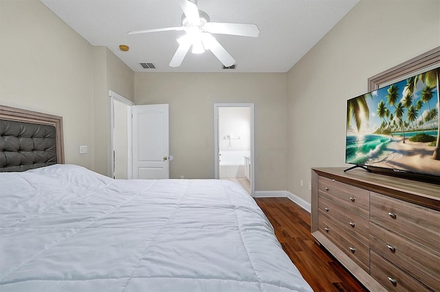 bedroom with visible vents, baseboards, dark wood finished floors, ensuite bathroom, and a ceiling fan