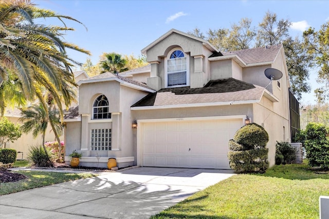 view of front of home with a front lawn, concrete driveway, central AC, roof with shingles, and stucco siding