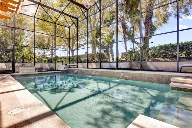 outdoor pool with glass enclosure and a patio