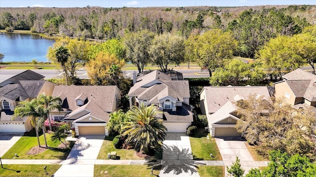 bird's eye view with a forest view, a residential view, and a water view