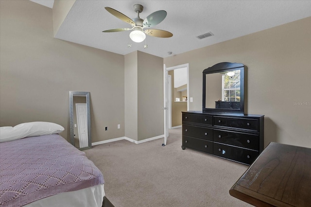 carpeted bedroom featuring visible vents, ceiling fan, and baseboards