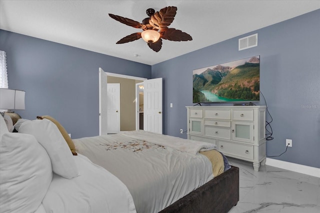 bedroom with visible vents, baseboards, marble finish floor, and ceiling fan