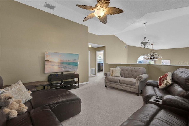 carpeted living area with ceiling fan with notable chandelier, lofted ceiling, a healthy amount of sunlight, and visible vents