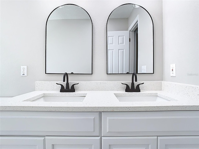 bathroom with double vanity and a sink