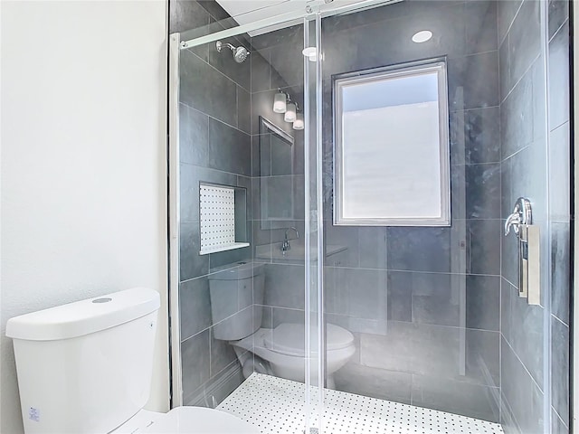 full bathroom with a stall shower and toilet