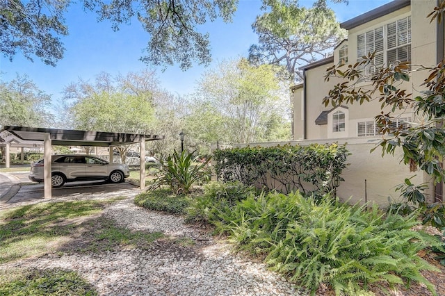 view of parking featuring a detached carport