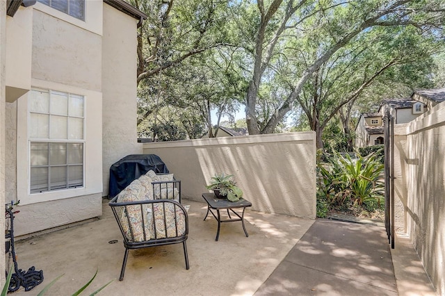 view of patio / terrace featuring area for grilling and fence