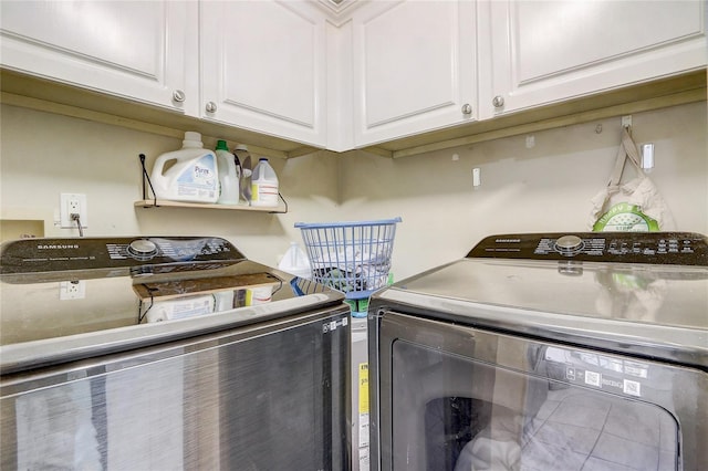 laundry area featuring cabinet space and separate washer and dryer