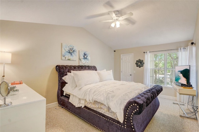 bedroom with light colored carpet, baseboards, lofted ceiling, and a ceiling fan