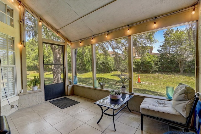 sunroom / solarium with lofted ceiling