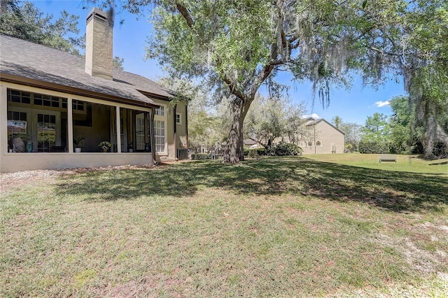 view of yard with a sunroom