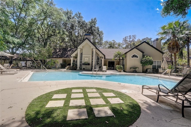 pool with a patio