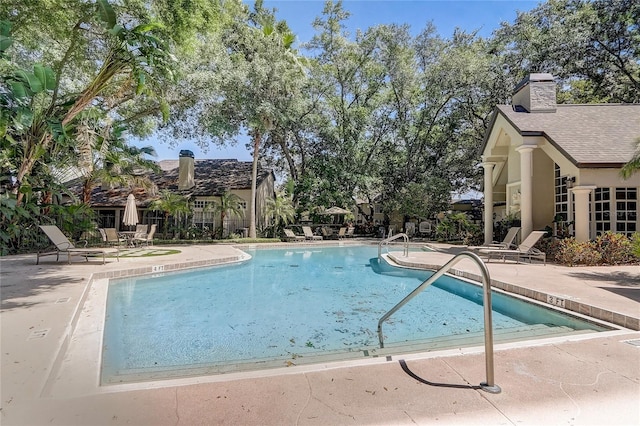 pool with a patio area