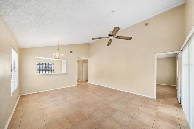 interior space featuring visible vents, ceiling fan with notable chandelier, a textured ceiling, light tile patterned flooring, and baseboards