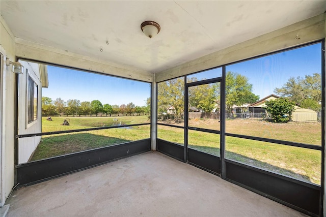 unfurnished sunroom featuring a wealth of natural light