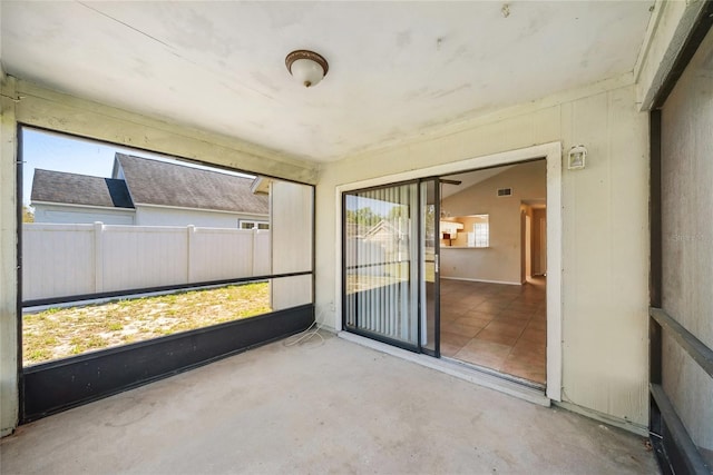 unfurnished sunroom with visible vents