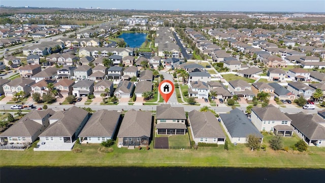 birds eye view of property featuring a residential view and a water view