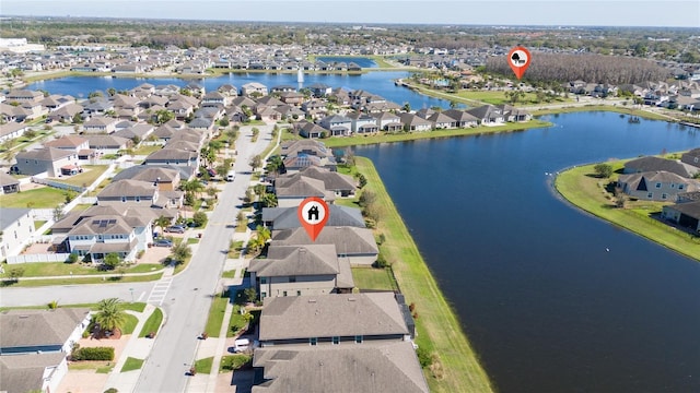 birds eye view of property featuring a residential view and a water view