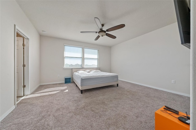 bedroom with baseboards, carpet, and ceiling fan