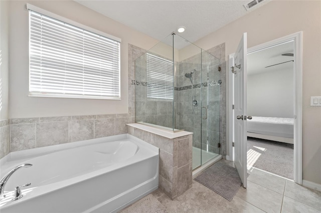 full bath with visible vents, ensuite bath, tile patterned flooring, a shower stall, and a bath