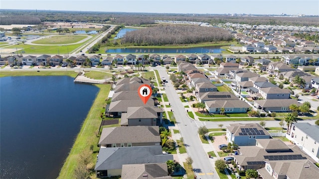 birds eye view of property featuring a water view and a residential view