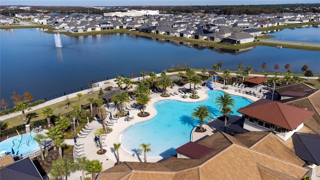 aerial view with a residential view and a water view