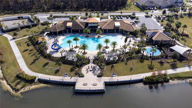 birds eye view of property with a water view