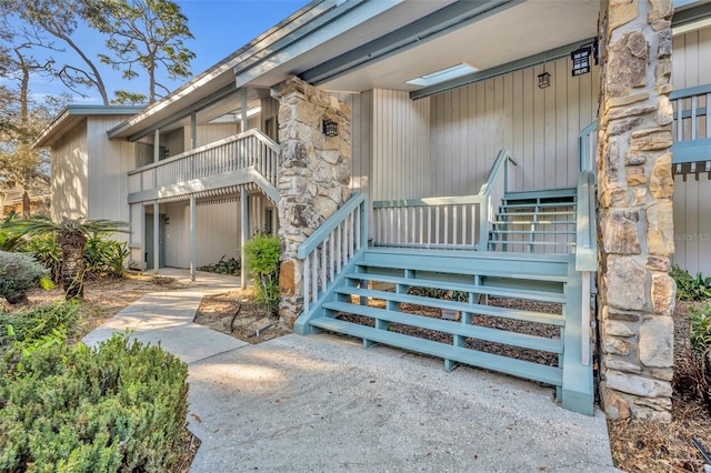 entrance to property featuring stone siding