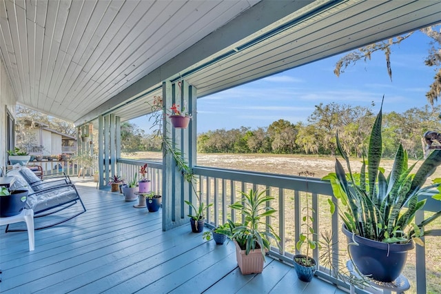 wooden terrace featuring a porch