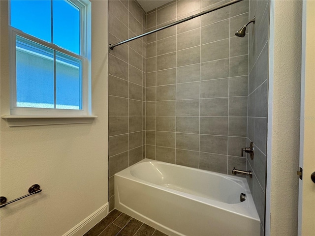 full bathroom featuring baseboards, shower / tub combination, and wood tiled floor