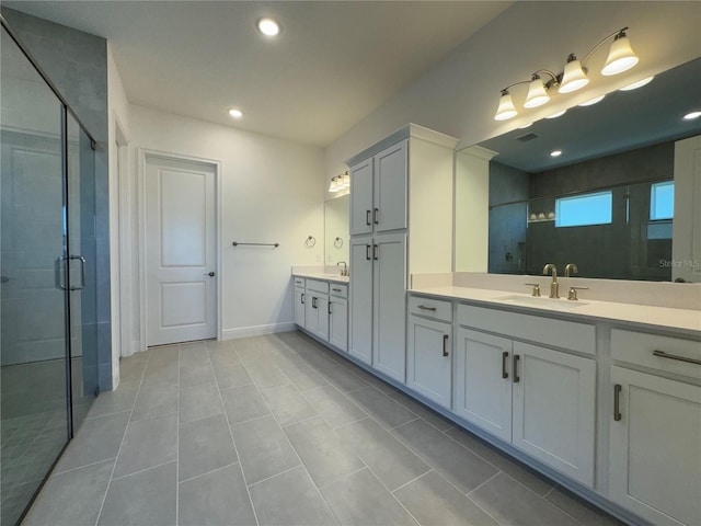 bathroom with recessed lighting, baseboards, a stall shower, and vanity