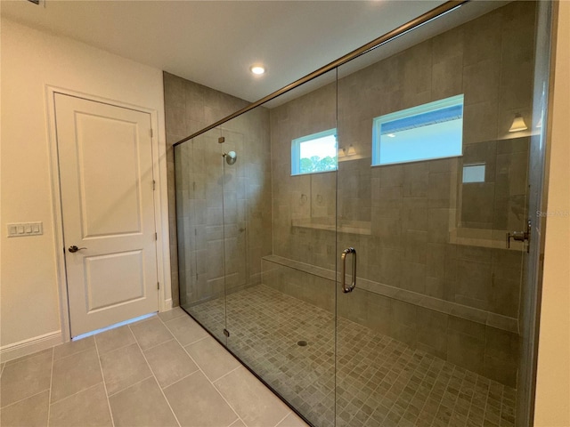 bathroom featuring tile patterned floors, recessed lighting, a stall shower, and baseboards