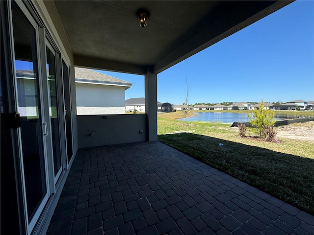 view of patio / terrace with a water view