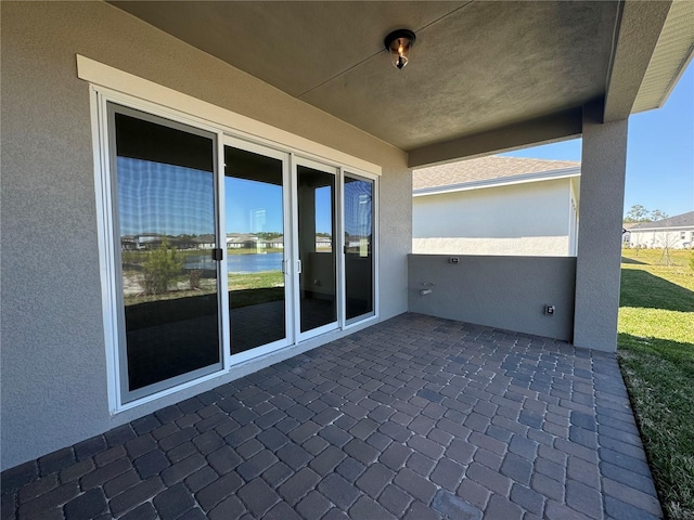 view of patio / terrace with a water view