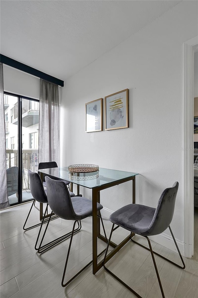 dining room featuring baseboards