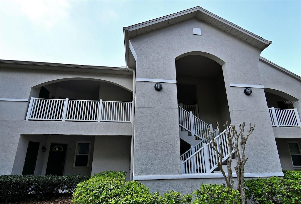 view of property featuring stairway