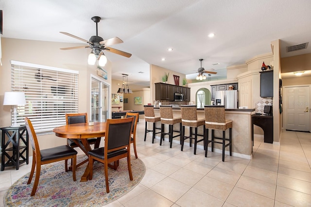 dining room featuring visible vents, vaulted ceiling, recessed lighting, light tile patterned flooring, and a ceiling fan