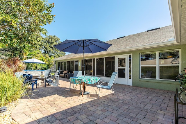 view of patio / terrace with a sunroom