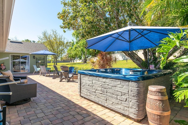 view of patio with a hot tub