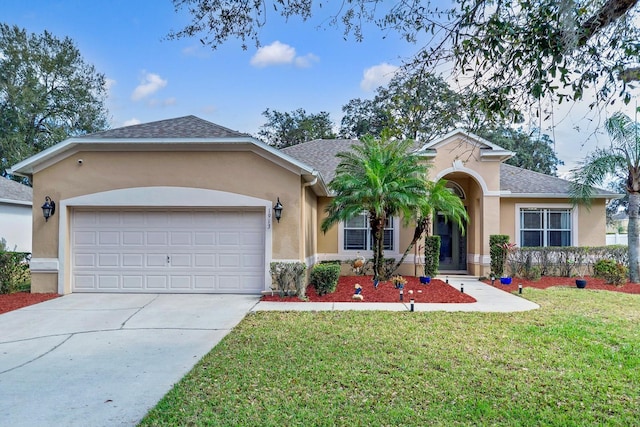 single story home with a garage, stucco siding, driveway, and a front yard